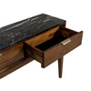 Perspective view showing the interior depth of the storage drawer and the thick profile of the black marble top