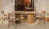 Lifestyle shot featuring the Sartoria marble table in an upscale interior styled with contemporary metal-frame dining chairs