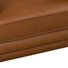 Close-up of the front seat cushion showcasing the high-quality stitching and smooth vegan leather texture