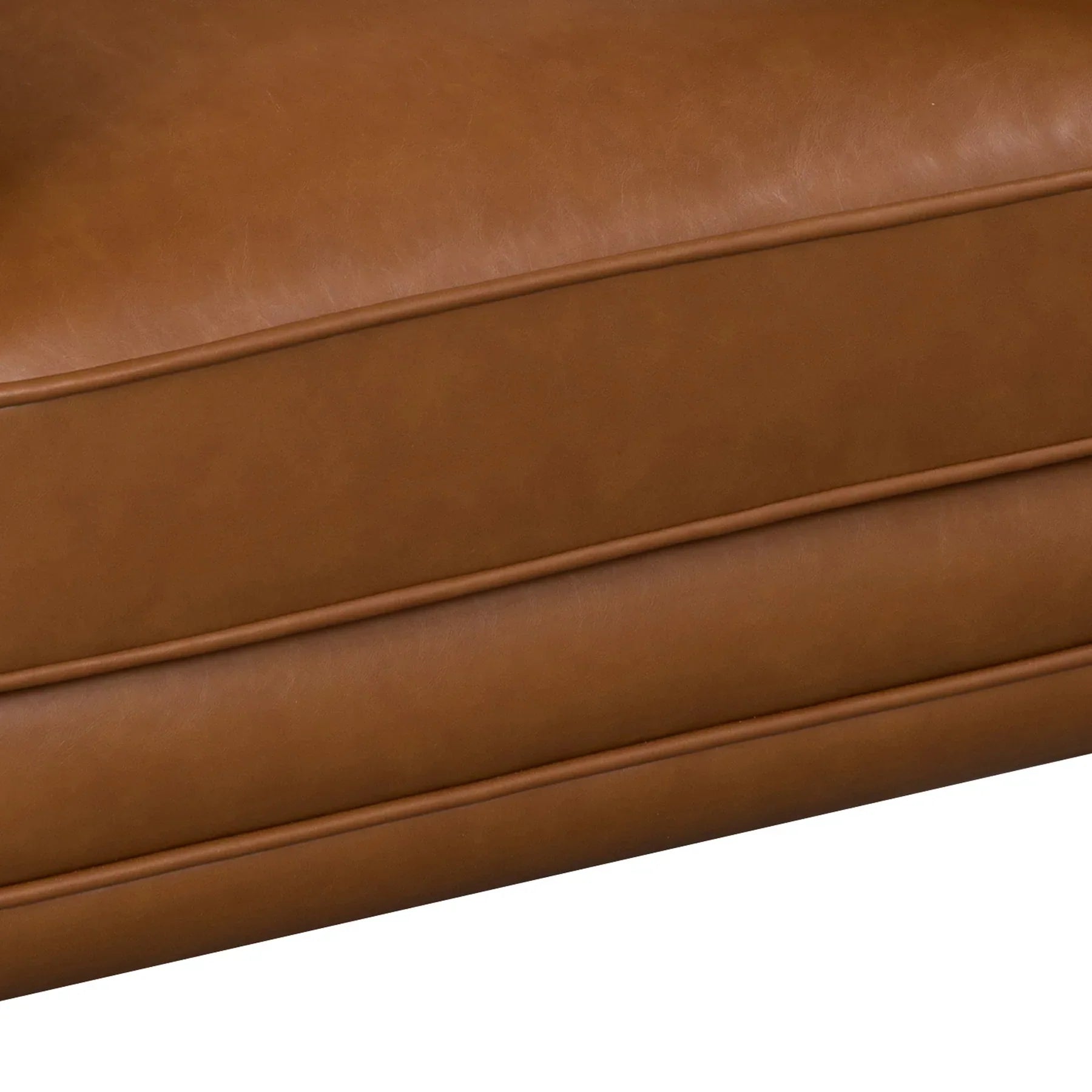 Close-up of the front seat cushion showcasing the high-quality stitching and smooth vegan leather texture