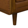 Detail shot of the tapered dark wood leg on the Mandalay sofa