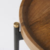 Close-up shot focusing on the transition between the warm wood tray top and the minimalist black metal frame