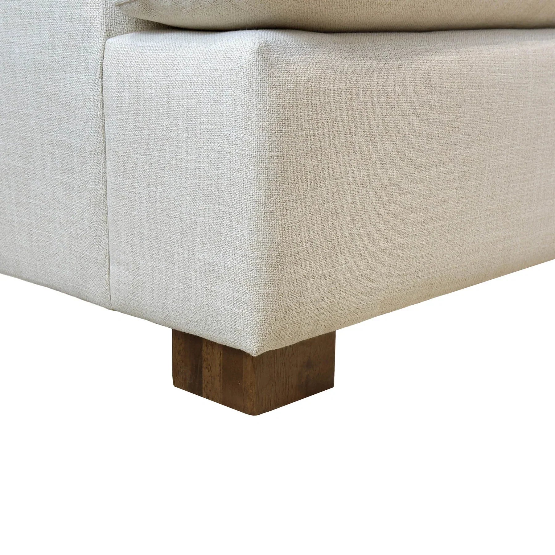 Close-up of the dark wood block leg and textured Beach Alabaster upholstery on the Martha sofa bed
