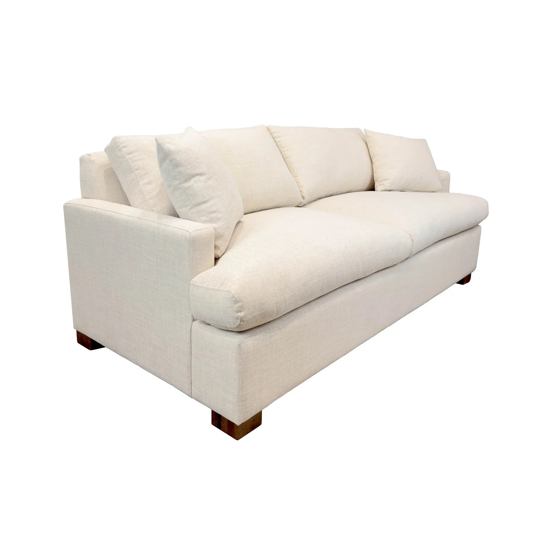 Three-quarter angled view of the Martha sofa bed showcasing its deep plush cushions and clean coastal silhouette