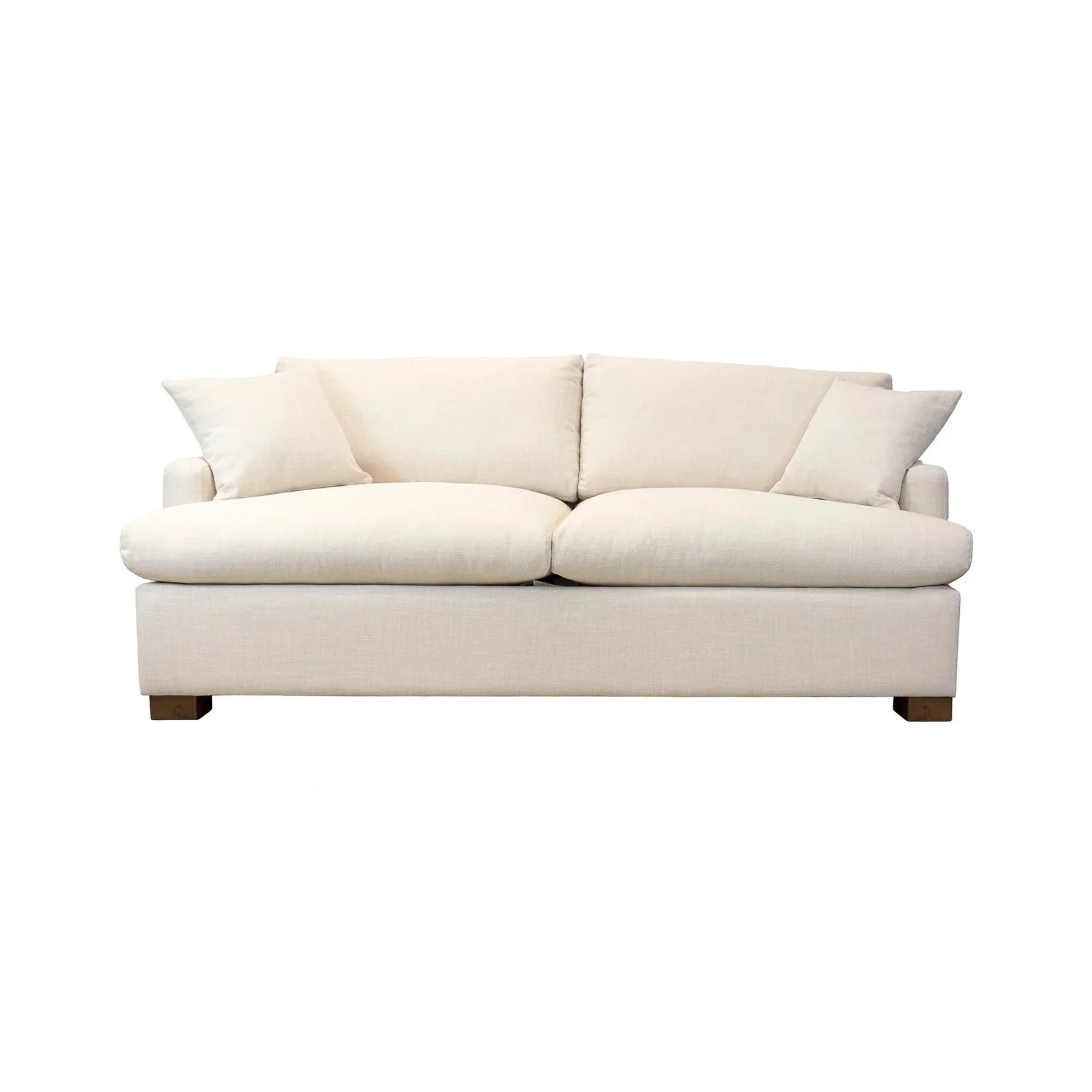 Front view of the Martha Queen Sofa Bed in Beach Alabaster fabric with two matching throw pillows and a low-profile wood base