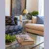 Detail of Martha sofa paired with a glass coffee table