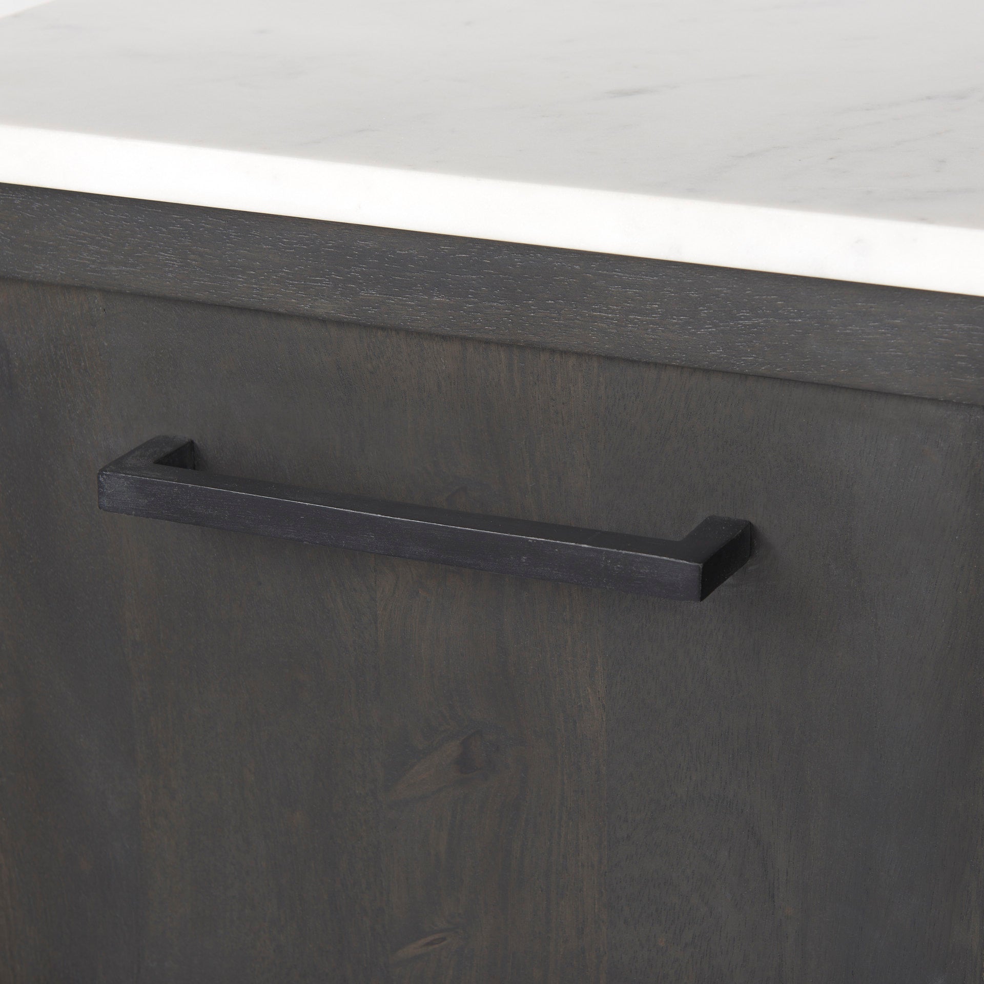 Front perspective view of the Gemma sideboard featuring a dark charcoal wood finish, a white marble top, and slim black metal legs