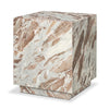 Perspective shot highlighting the heavy veining and natural color variations of the pink marble on the top and sides of the cube table