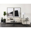 Lifestyle shot featuring the Maxwell coffee table in a modern living room styled with a white sofa and monochrome wall art