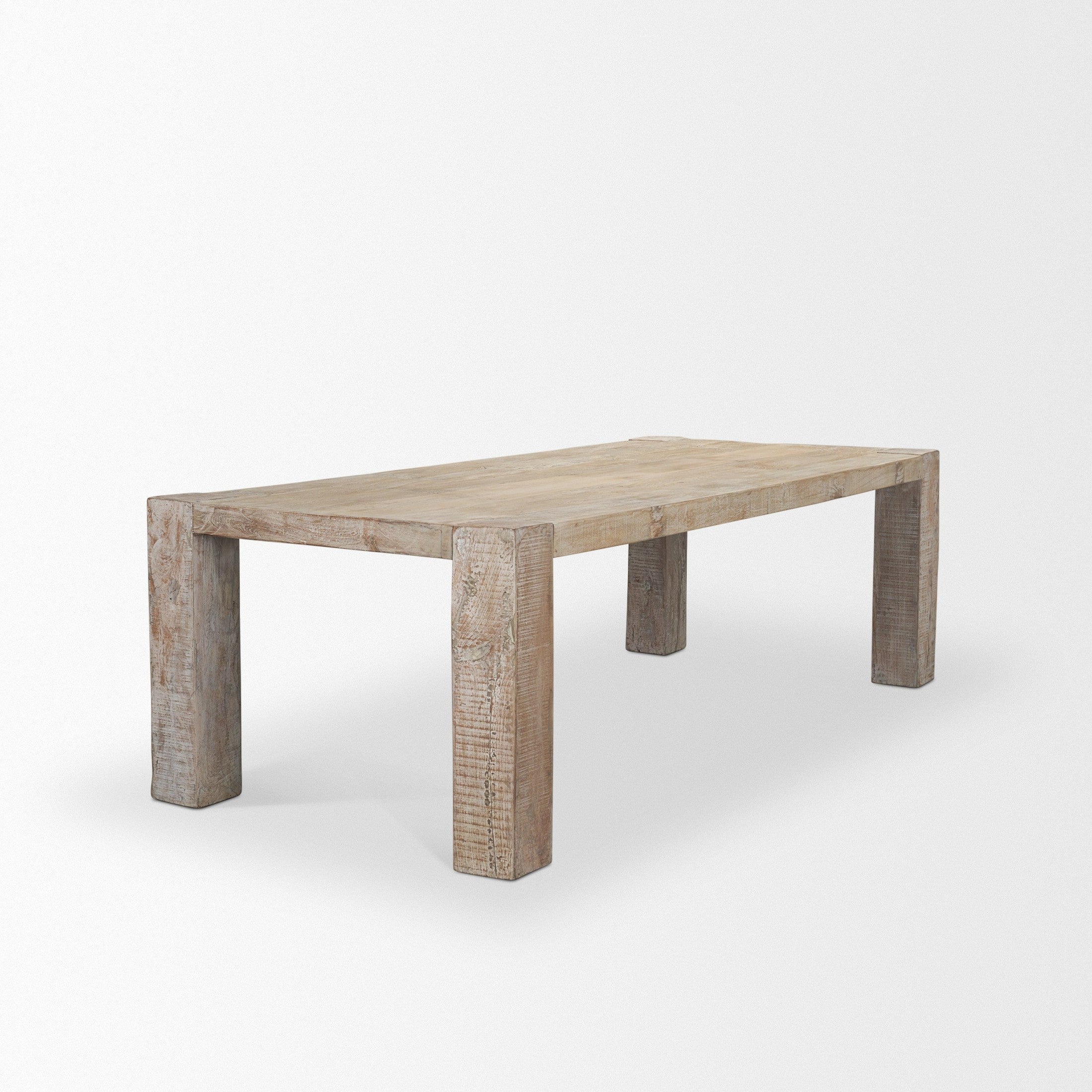 Front view of the 94-inch McArthur dining table featuring a whitewash finish and a substantial Parsons-style reclaimed wood construction