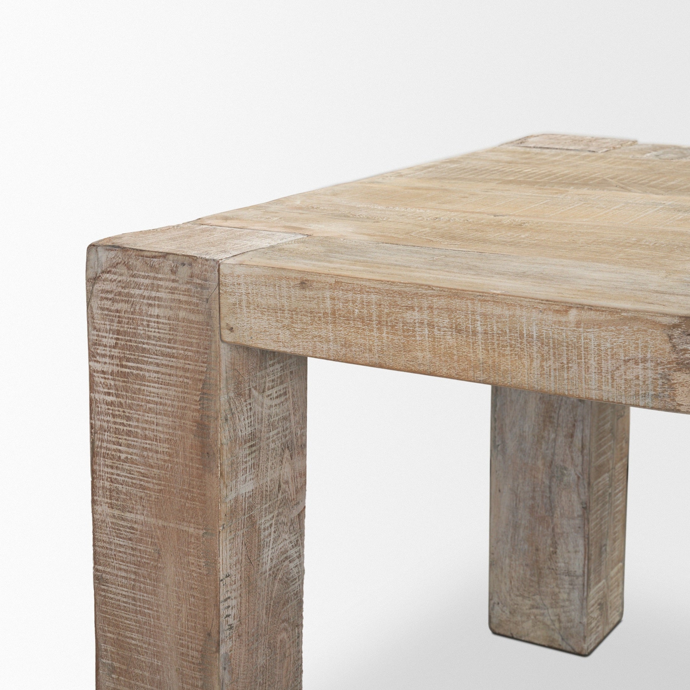 Front view of the 94-inch McArthur dining table featuring a whitewash finish and a substantial Parsons-style reclaimed wood construction