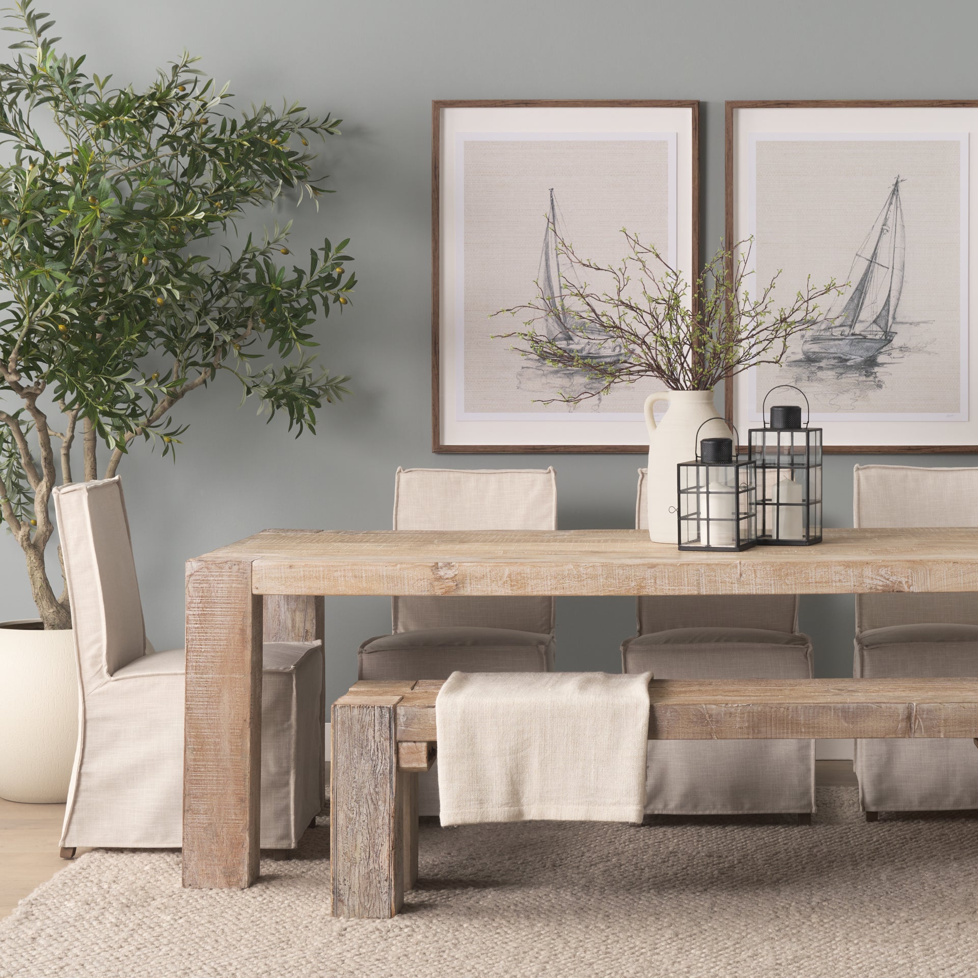 Front view of the 94-inch McArthur dining table featuring a whitewash finish and a substantial Parsons-style reclaimed wood construction