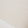 Macro view of the Mellow Ivory fabric highlighting the soft, multi-tonal weave used on the Unio collection.