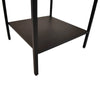 Detail shot focusing on the sturdy construction and matte finish of the black metal lower shelf and legs