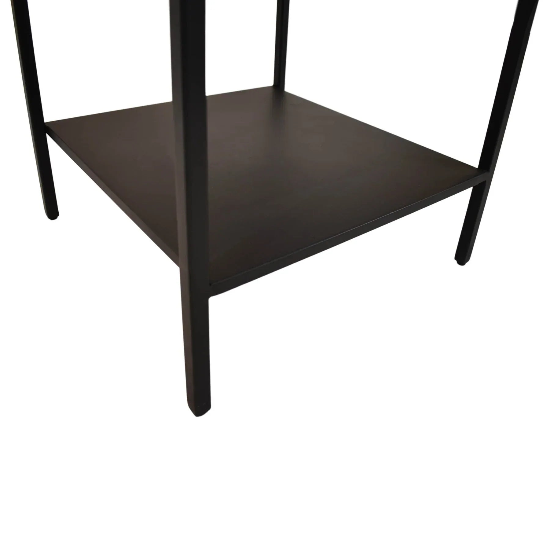 Three-quarter view of a square side table featuring a white mosaic terrazzo top and a black metal frame with a lower storage shelf