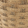 Macro view of the light brown seagrass fibers demonstrating the high-quality tactile checkered weaving technique