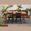 Lifestyle shot highlighting the sideboard as part of a cohesive dining set with a matching wood table and black chairs