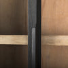 Macro shot highlighting the sleek integrated vertical door handle and natural wood grain texture