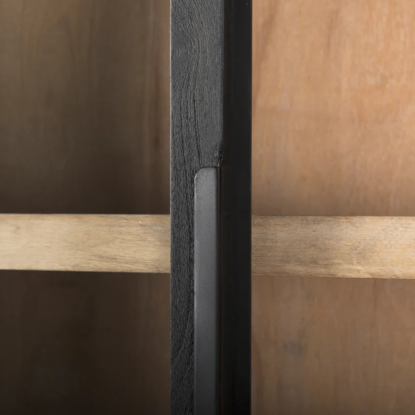 Straight-on front view of the Sloan arch cabinet featuring a matte black finish and natural wood interior shelves