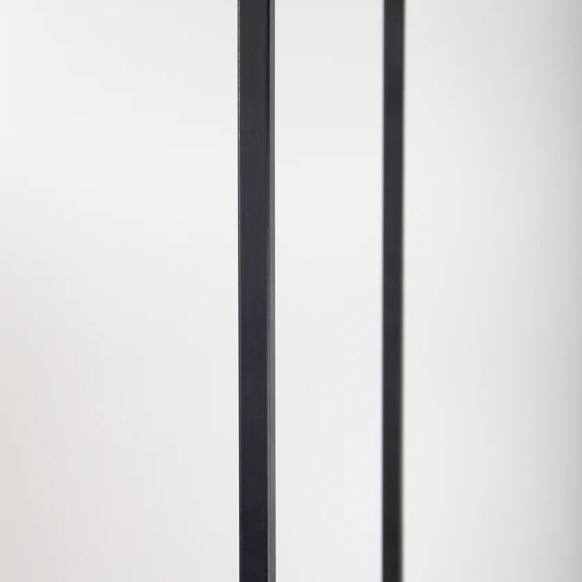 Perspective view of the Morris 6-tier shelving unit featuring a black metal frame and light brown wood shelves in an asymmetrical layout