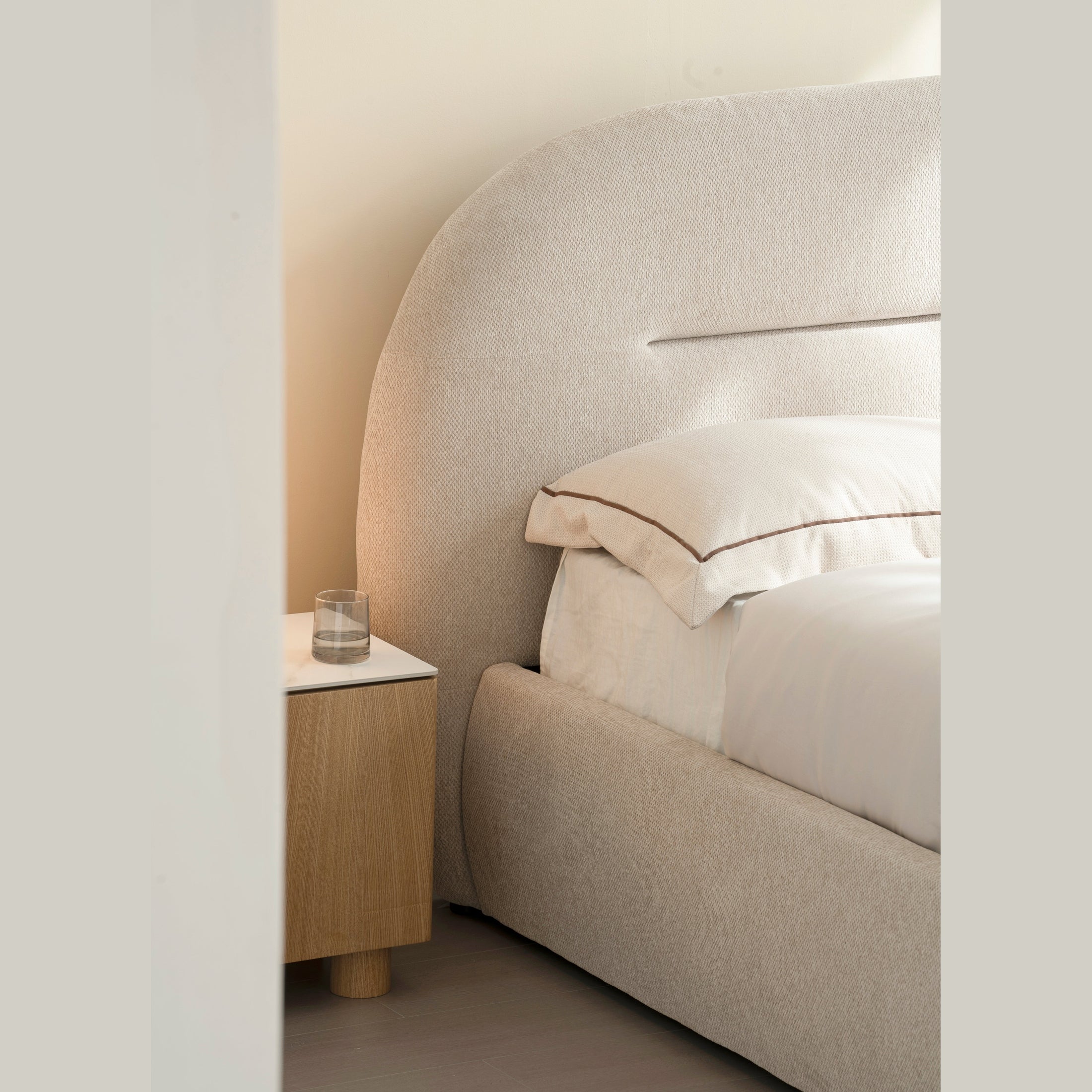 Detailed shot of the lower frame highlighting the cylindrical minimalist legs and secure base support
