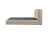 Side profile view highlighting the thick cushioned headboard and the seamless rounded corners of the upholstered bed base