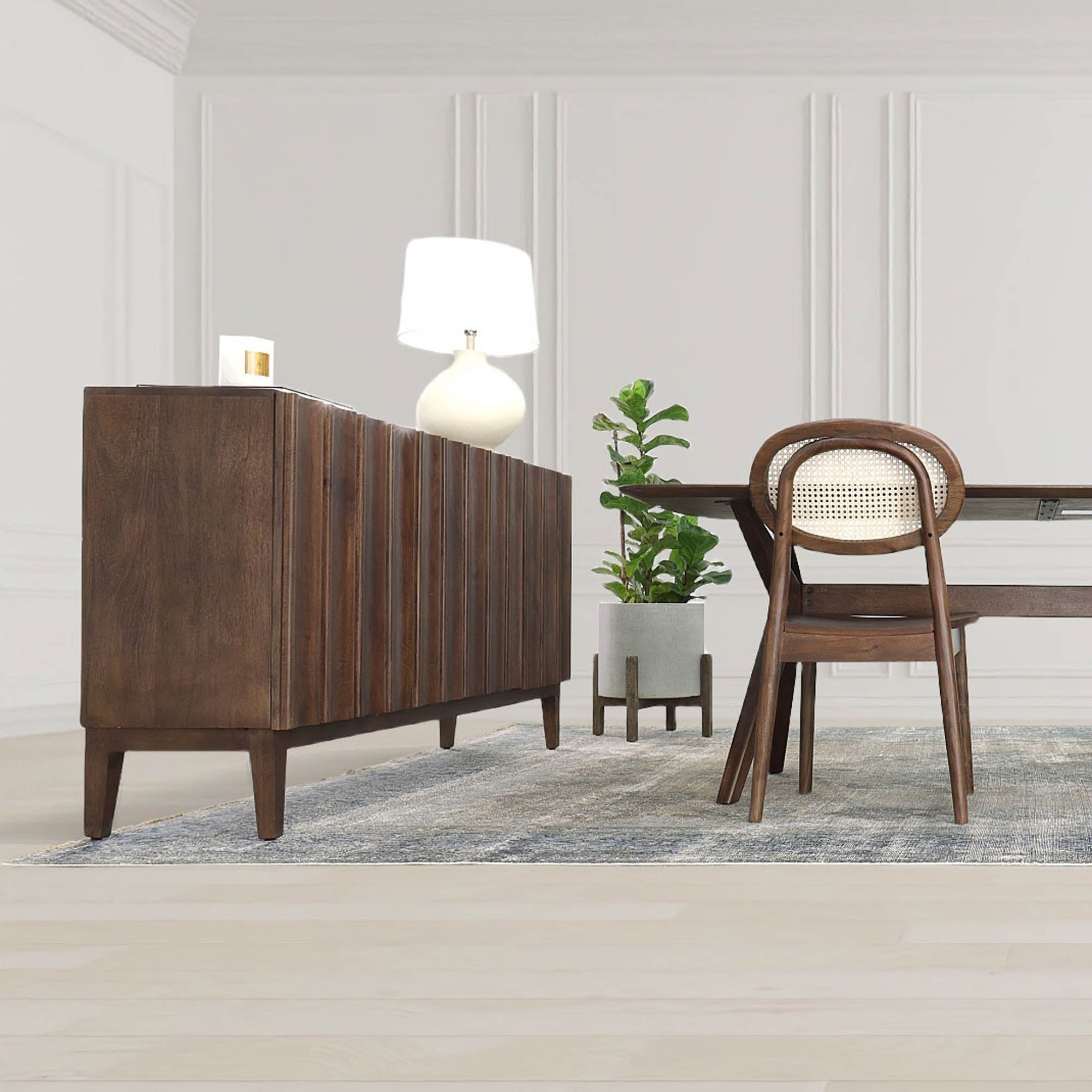 Straight-on front view highlighting the symmetrical vertical fluting and the seamless hardware-free aesthetic of the dark wood cabinet