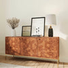 Angled lifestyle shot focusing on the sideboard surface styled with a ceramic vase and modern decor in an airy dining space