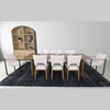 Broad view of the cabinet styled alongside a matching dining table and chairs in a contemporary setting