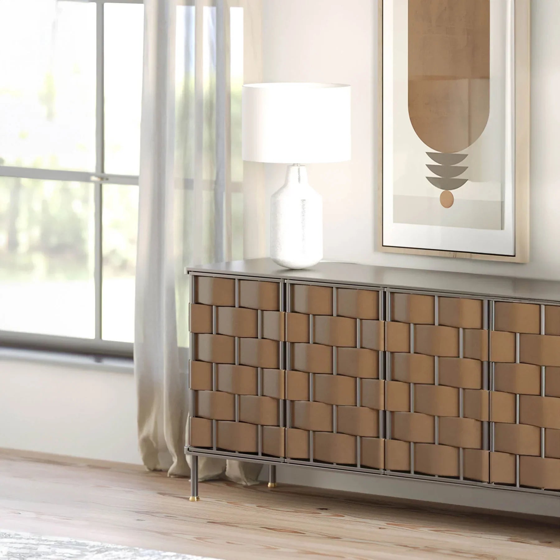 Front view of the Bishop sideboard featuring a hand-woven cognac brown leather panel design set within a slim dark metal frame