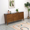Angled lifestyle shot featuring the sideboard styled with organic accessories in an airy modern home environment