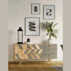 Lifestyle shot showcasing the sideboard in a bright minimalist setting with a clean gallery wall and potted plants