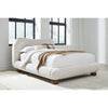 Angled lifestyle perspective showcasing the bed as a soft architectural focal point in a modern minimalist room setting