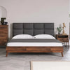 Studio lifestyle shot showcasing the bed styled with matching dark wood nightstands in a clean contemporary setting