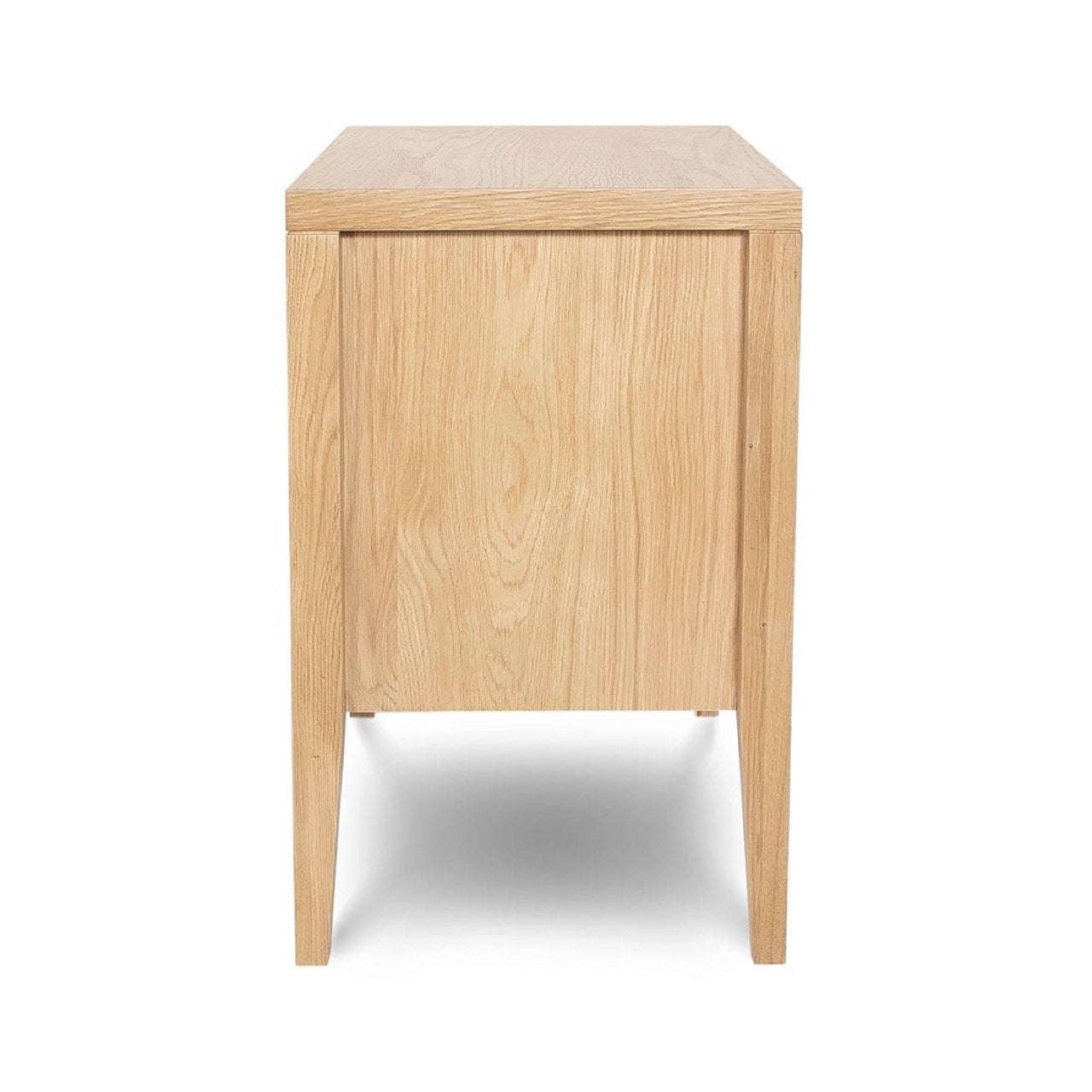 Side profile view emphasizing the slim vertical silhouette and the precision-tapered leg design