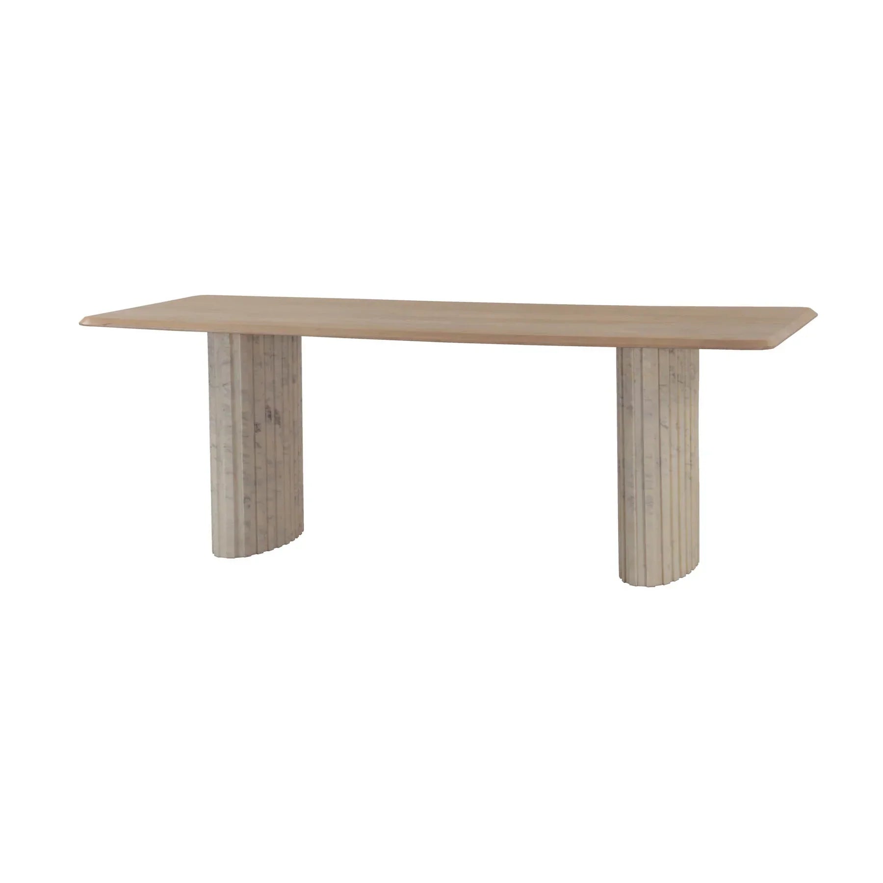Front view of the Hedron dining table in a natural oak finish featuring rounded corners and two thick ribbed pedestal legs