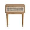 Straight-on front view showcasing the clean lines of the oak frame and the high-contrast white rattan caning