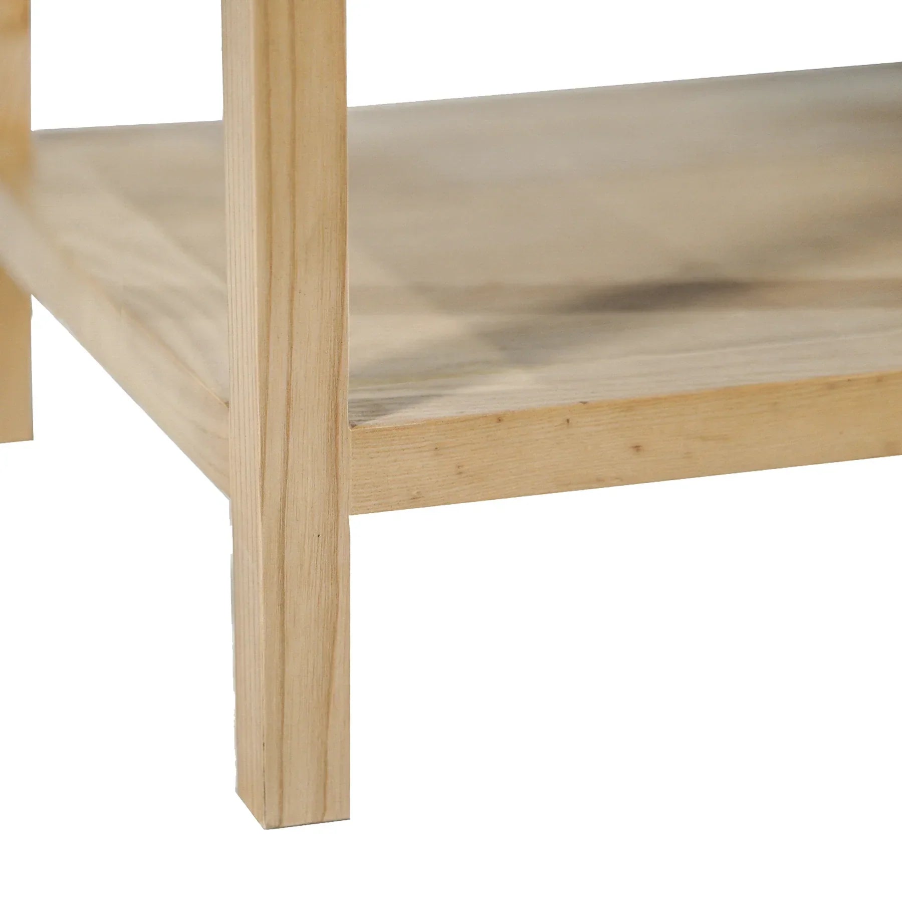 Straight-on front view showcasing the woven rattan drawer front and minimalist brass hardware on a light wood frame