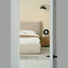 Perspective view from a doorway highlighting the inviting and cozy aesthetic of the Aici storage bed