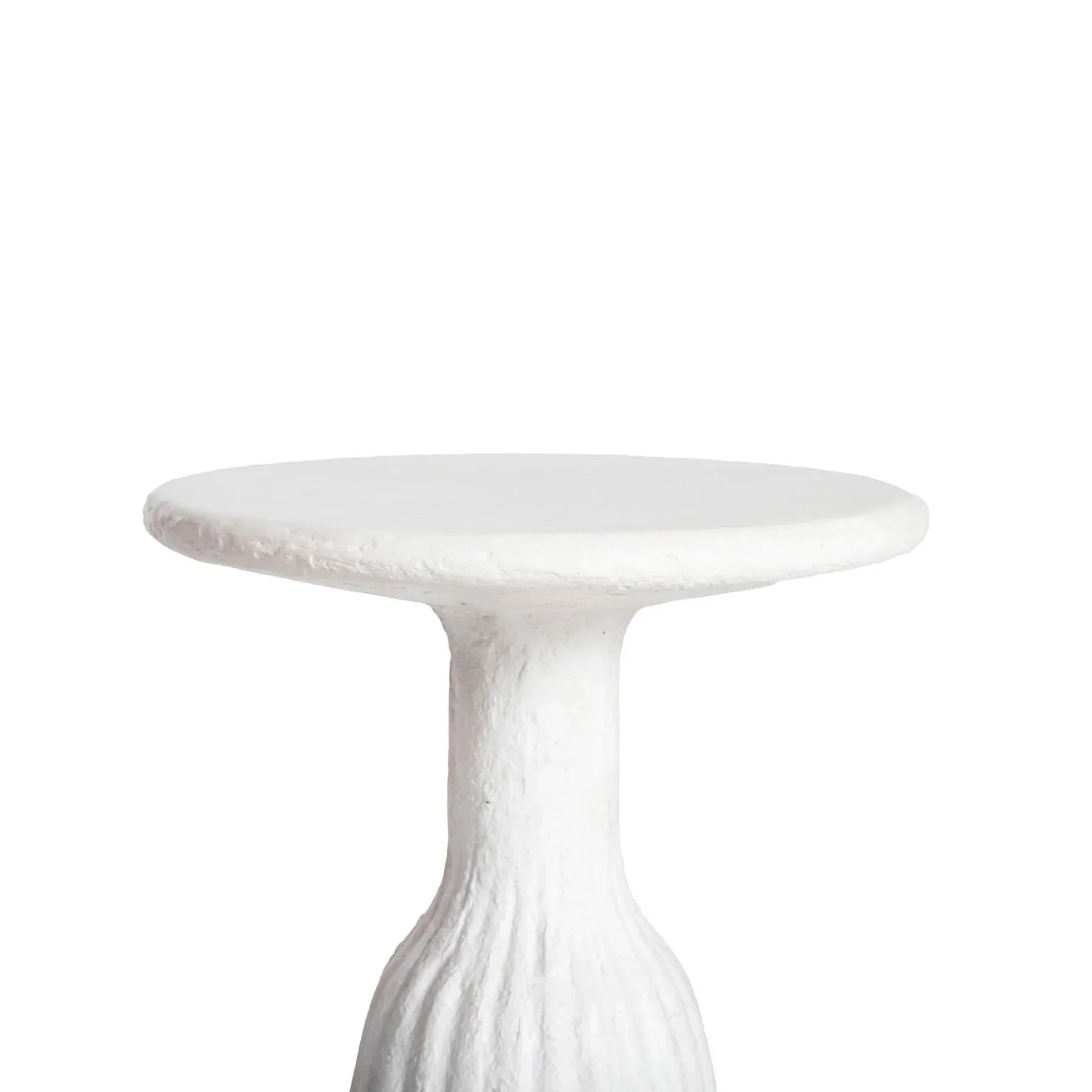 Front view of a white minimalist side table featuring a circular top and a unique fluted hourglass pedestal base with a textured plaster-like finish