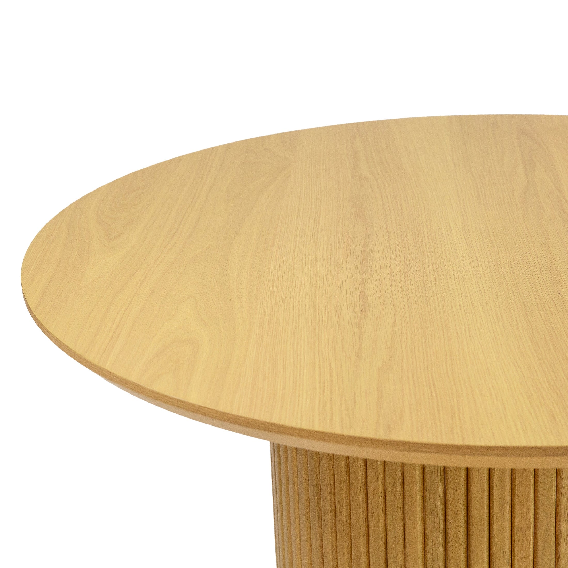 Front view of the Valdemar round dining table featuring a natural oak wood finish and a striking cylindrical fluted pedestal base