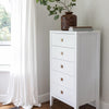 Alternate lifestyle perspective highlighting the dresser's slim vertical silhouette against a neutral wall