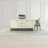 Wide studio shot of the Starlight sideboard positioned on a light wood floor with a minimalist plant and modern wall paneling