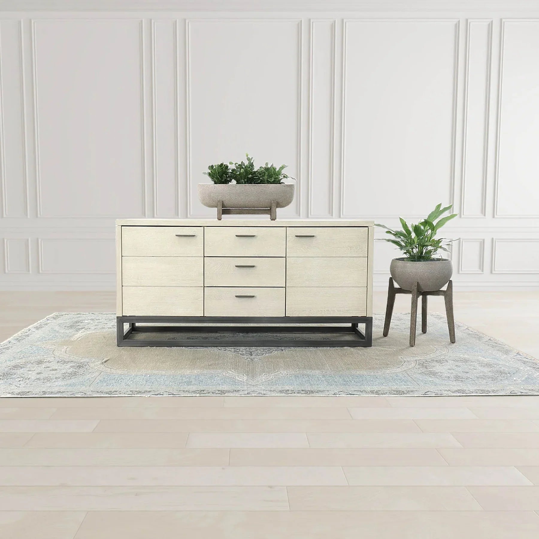 Front perspective view of the Starlight sideboard featuring a white ash wood finish, six storage drawers, and a black industrial metal sled base