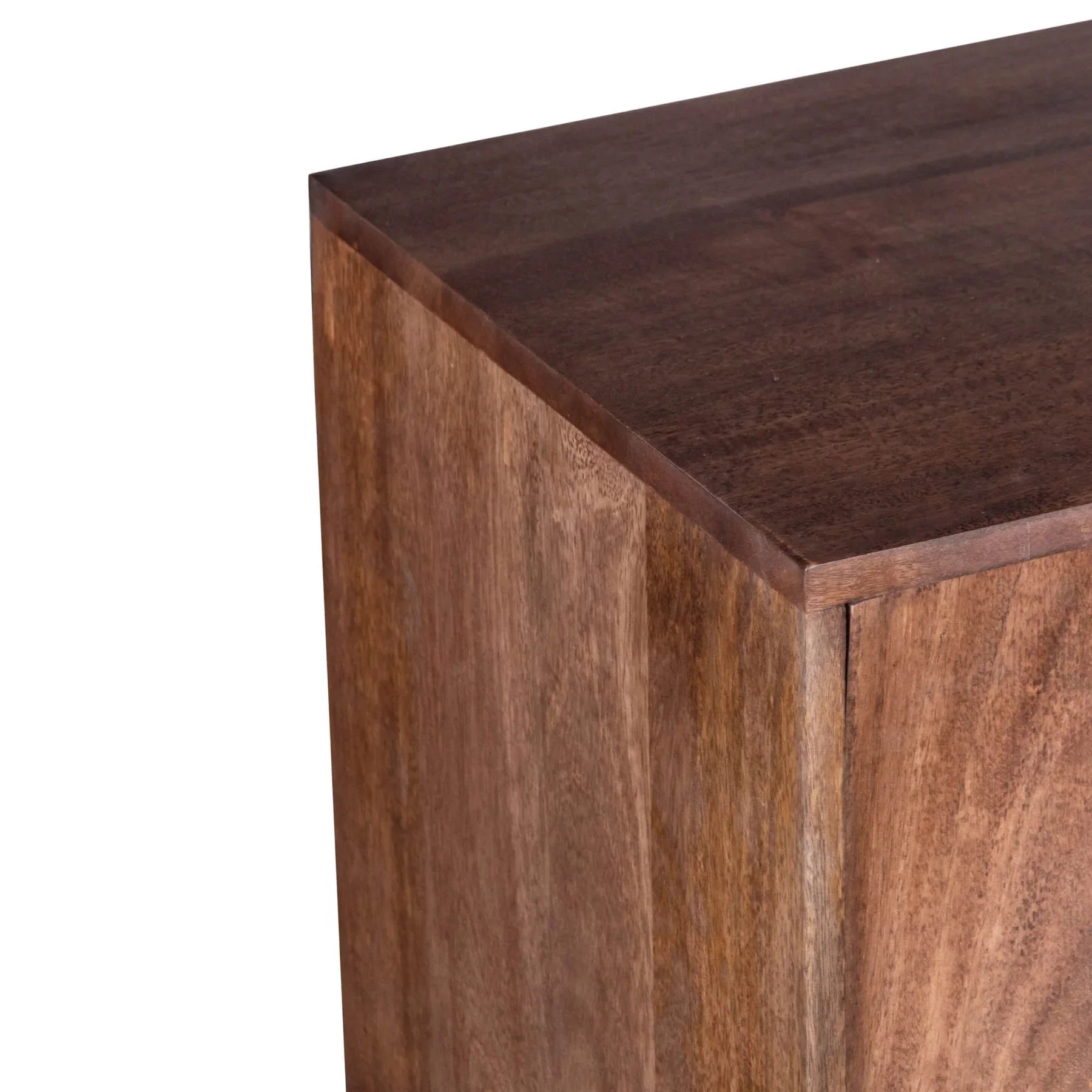 Three-quarter perspective view of the Caracol sideboard featuring a rich natural mango wood finish and a large hand-carved concentric circle design across four doors