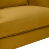 Close-up of the plush mustard velvet seat cushion highlighting the high-quality upholstery stitching