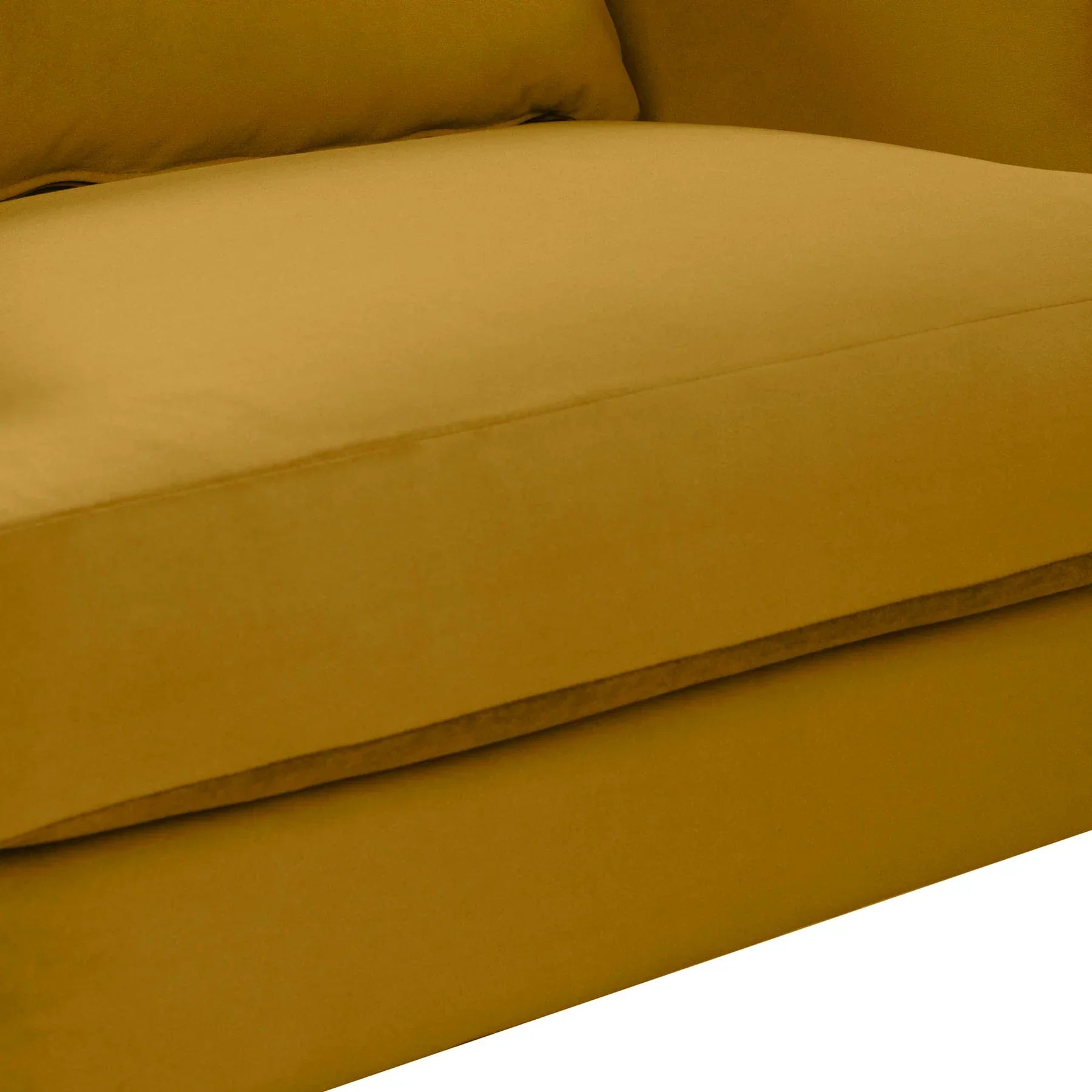 Close-up of the plush mustard velvet seat cushion highlighting the high-quality upholstery stitching