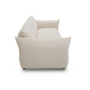 Minimalist side profile of the Moa cream fabric sofa