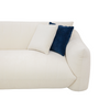 Close-up of cream fabric upholstery on the Moa sofa corner