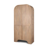 Three-quarter perspective view highlighting the deep arched silhouette and consistent fluted texture across the doors